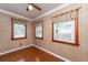 Bedroom featuring three windows allowing for great natural light and hardwood floors at 1226 Forestwood Dr, Charleston, SC 29407