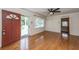 Bright living room features hardwood floors, fan, and a large window at 1226 Forestwood Dr, Charleston, SC 29407
