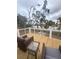 Inviting deck featuring outdoor seating, ideal for taking in the peaceful waterfront scenery at 123 Jungle Rd, Edisto Island, SC 29438