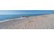 Beautiful beach scene with gentle waves, soft sand, and clear blue skies, perfect for relaxation at 123 Jungle Rd, Edisto Island, SC 29438