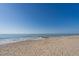 Expansive beach with a clear blue sky and calm ocean waters at 123 Jungle Rd, Edisto Island, SC 29438