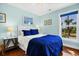 Comfortable bedroom with blue bedding and marsh views at 123 Jungle Rd, Edisto Island, SC 29438