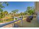 Spacious deck with outdoor seating and serene views of the marsh at 123 Jungle Rd, Edisto Island, SC 29438