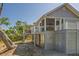 Charming coastal home with elevated design, spacious decks, and covered outdoor area for entertaining at 123 Jungle Rd, Edisto Island, SC 29438