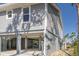 Coastal home featuring an elevated design and spacious covered outdoor area, perfect for enjoying the serene surroundings at 123 Jungle Rd, Edisto Island, SC 29438