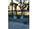Cozy fire pit area with four Adirondack chairs, perfect for outdoor gatherings and enjoying the scenery at 123 Jungle Rd, Edisto Island, SC 29438