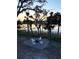 Enjoy evenings by the fire pit surrounded by mature trees, offering a peaceful outdoor retreat at 123 Jungle Rd, Edisto Island, SC 29438
