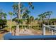Firepit area with Adirondack chairs and views of the marsh at 123 Jungle Rd, Edisto Island, SC 29438