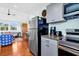 Efficient kitchen with stainless steel appliances and hardwood floors at 123 Jungle Rd, Edisto Island, SC 29438