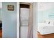 Convenient laundry closet with a stacked washer and dryer, located near the bedroom at 123 Jungle Rd, Edisto Island, SC 29438