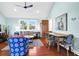 Bright living room featuring an open layout, dining table, and hardwood floors at 123 Jungle Rd, Edisto Island, SC 29438