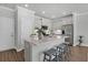 Modern kitchen featuring an island with bar seating, stainless steel appliances, and white cabinetry at 129 Brown Swiss Cir, Summerville, SC 29483