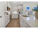 Bright kitchen with white cabinets, stainless steel appliances, and quartz countertops at 129 Brown Swiss Cir, Summerville, SC 29483