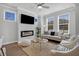 Comfortable living room with a fireplace, a cozy sofa, neutral color and a ceiling fan at 129 Brown Swiss Cir, Summerville, SC 29483