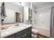 Bathroom vanity with a vessel sink and tile surround with built-in shower and bath at 1300 Park West Blvd # 811, Mount Pleasant, SC 29466