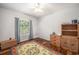 Cozy bedroom featuring hardwood floors, a ceiling fan, a window with blinds, and woven storage at 1300 Park West Blvd # 811, Mount Pleasant, SC 29466