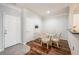 Dining room showcasing hard surface floors, table, and access to kitchen at 1300 Park West Blvd # 811, Mount Pleasant, SC 29466