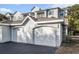 Attached two-car garage with arched doors, offering convenient parking and storage space at 1300 Park West Blvd # 811, Mount Pleasant, SC 29466