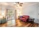 Living room showing hard surface floors, ceiling fan, sliding glass door, and furniture at 1300 Park West Blvd # 811, Mount Pleasant, SC 29466
