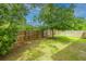 Secluded backyard featuring a well-kept lawn, a mature tree, and a freshly installed wooden fence at 133 Alder Cir, Charleston, SC 29412