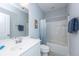 This bathroom features a sleek white vanity, a large mirror, and a shower-tub combination with stylish blue accents at 133 Alder Cir, Charleston, SC 29412