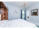 Cozy bedroom with a chandelier and a view of the trees at 133 Alder Cir, Charleston, SC 29412