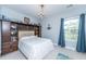 Charming bedroom featuring an armoire, chandelier and large window at 133 Alder Cir, Charleston, SC 29412