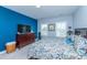 Comfortable bedroom with a blue accent wall features natural light and cozy furnishings at 133 Alder Cir, Charleston, SC 29412