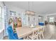 Cozy dining room with a wooden table, blue accents, and a view of the surrounding greenery at 133 Alder Cir, Charleston, SC 29412