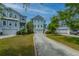 Beautifully landscaped home with a charming walkway and ample green space at 133 Alder Cir, Charleston, SC 29412