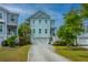 Inviting two-story home with a garage and well-maintained lawn at 133 Alder Cir, Charleston, SC 29412
