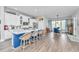 Modern kitchen with white cabinets, granite countertops, and a large island with bar seating at 133 Alder Cir, Charleston, SC 29412