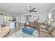 Bright and open living space with a ceiling fan and seamless flow to kitchen and dining at 133 Alder Cir, Charleston, SC 29412