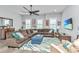 Spacious living room with ample seating, a decorative rug, and plenty of natural light at 133 Alder Cir, Charleston, SC 29412