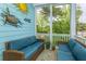 Inviting porch with cozy seating, charming decor, and a view of lush surroundings at 133 Alder Cir, Charleston, SC 29412