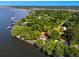 Aerial shot of a charming home with a private dock, lush greenery, and stunning waterfront views at 1405 S Edgewater Dr, Charleston, SC 29407