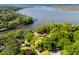 Stunning aerial view of a home nestled among lush trees with waterfront access and scenic river views at 1405 S Edgewater Dr, Charleston, SC 29407