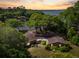 Charming home surrounded by mature trees, offering privacy and a tranquil setting with water views at 1405 S Edgewater Dr, Charleston, SC 29407