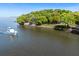 Waterfront home on a beautiful point lot with surrounding trees, offering privacy and scenic views at 1405 S Edgewater Dr, Charleston, SC 29407
