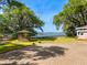 This well-maintained backyard features a brick patio, gazebo, lush lawn, and waterfront views at 1405 S Edgewater Dr, Charleston, SC 29407