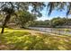 Picturesque backyard featuring a gazebo, mature trees, and waterfront views at 1405 S Edgewater Dr, Charleston, SC 29407