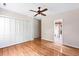 Spacious bedroom with hardwood floors, ceiling fan, and closet at 1405 S Edgewater Dr, Charleston, SC 29407