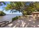 Inviting waterfront deck complete with grill and views of the waterway surrounded by trees at 1405 S Edgewater Dr, Charleston, SC 29407