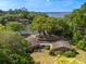 Stunning waterfront home with lush trees, gorgeous landscaping and a charming pergola-covered entrance at 1405 S Edgewater Dr, Charleston, SC 29407