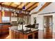 Bright kitchen with a large center island, wooden cabinetry and a view of the backyard at 1405 S Edgewater Dr, Charleston, SC 29407
