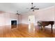 Spacious living room with hardwood floors, fireplace, and natural light; ideal for gatherings and relaxation at 1405 S Edgewater Dr, Charleston, SC 29407