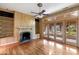 Comfortable living room with built-in shelving, fireplace, and direct access to the sunroom at 1405 S Edgewater Dr, Charleston, SC 29407