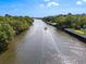 Picturesque river view featuring a boat cruising along the waterway surrounded by lush greenery at 1405 S Edgewater Dr, Charleston, SC 29407