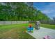 Fenced backyard featuring a grill, toys, and a patio, perfect for outdoor entertaining and play at 141 Clydesdale Cir, Summerville, SC 29486