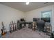 Bedroom featuring a gray desk setup with multiple monitors and musical instruments for creative pursuits at 141 Clydesdale Cir, Summerville, SC 29486